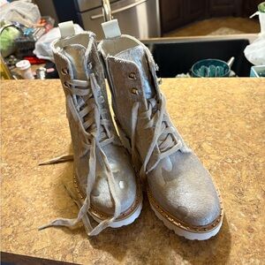 Metallic boots; lug soles1 1/2 inch heels. I wore 1 time